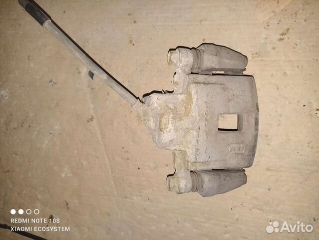 Суппорт левый передний Kia Spectra 2011год б.у