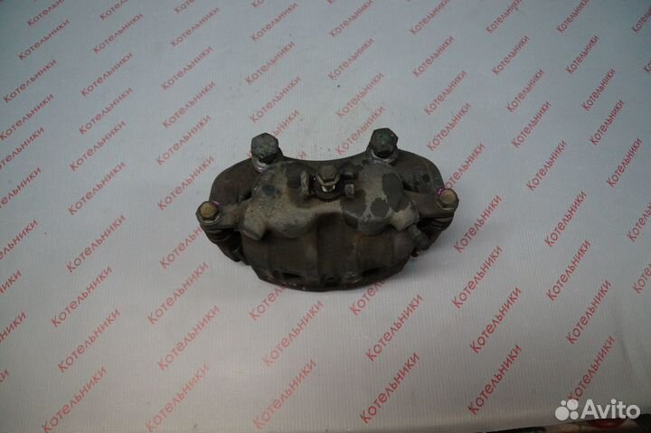 Nissan 41011-4N000 Суппорт тормозной передний L