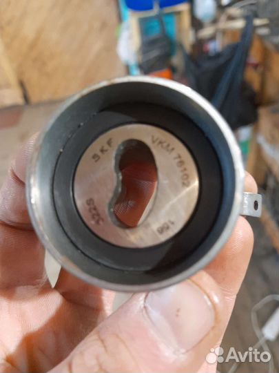 Ролик натяжителя ремня грм Лансер 9