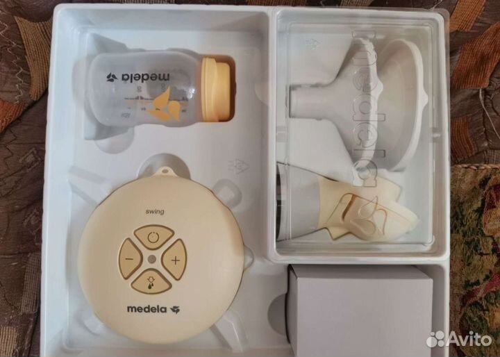 Молокоотсос medela электрический