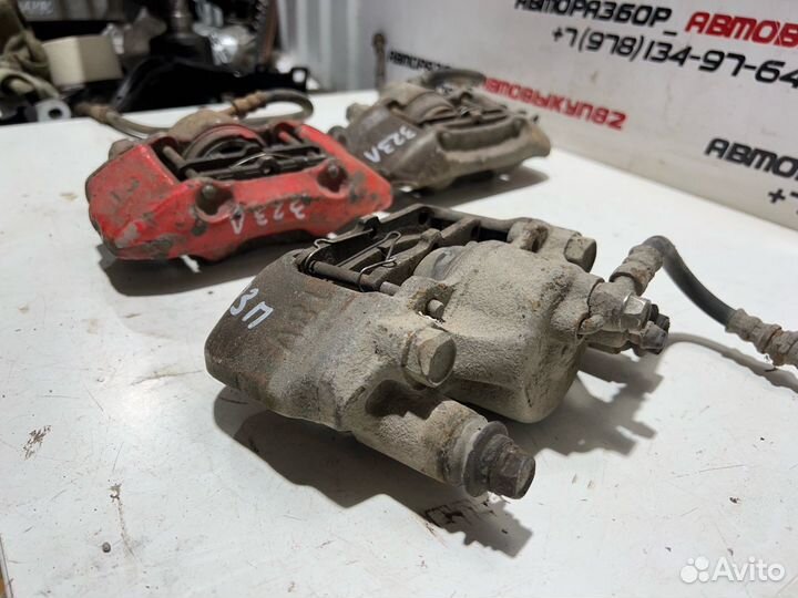 Суппорт передний левый правый mazda 323f 323 BG