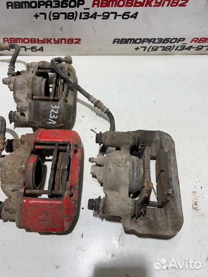 Суппорт передний левый правый mazda 323f 323 BG