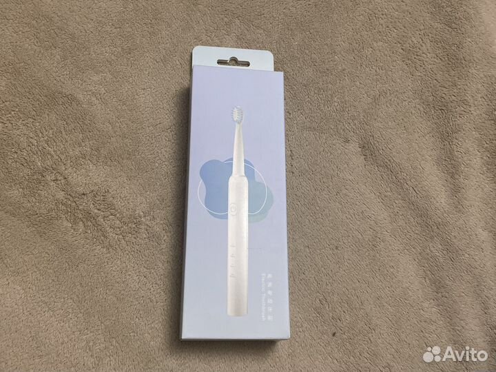 Электрическая зубная щетка