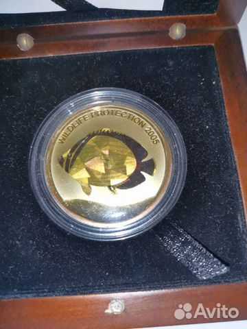 Монета жёлтая рыба