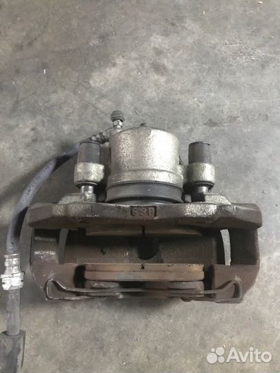 Суппорт тормозной передний левый Mazda 3 BK 2.0