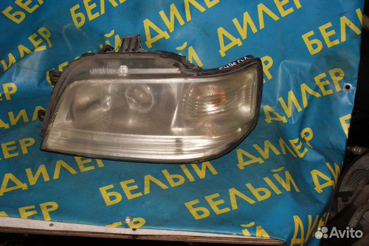 Фара Nissan Cube