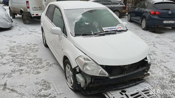 Накладка заднего бампера левая Nissan Tiida (C11) 85075-EM10A