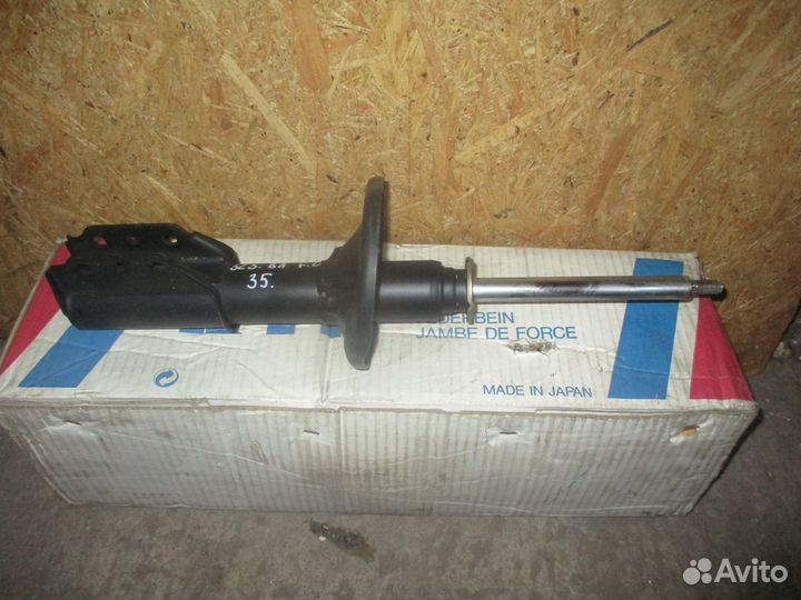 Стойка амортизатор Mazda 323 1994-1998