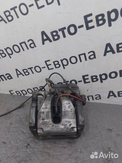 Суппорт с электроручником задний правый Land Rover