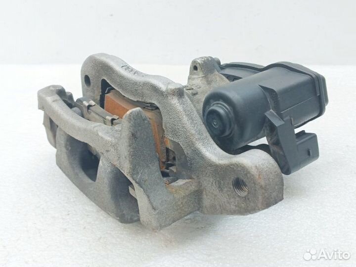 Суппорт тормозной задний левый Nissan Qashqai J11