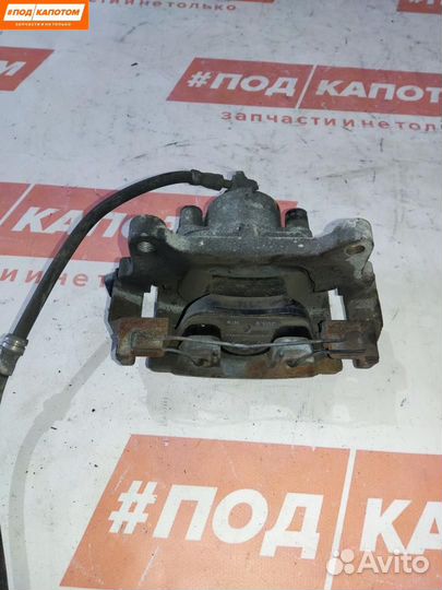 Суппорт тормозной передний левый Volkswagen Tiguan