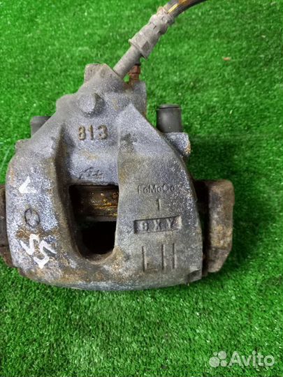 Суппорт тормозной передний левый Ford Focus shda