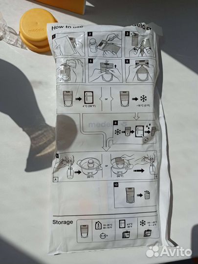 Молокоотсос medela ручной и пакеты для молока