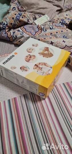 Молокоотсос medela электрический