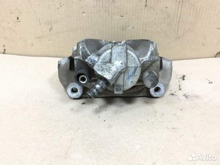 Суппорт тормозной передний левый Nissan Terrano 3