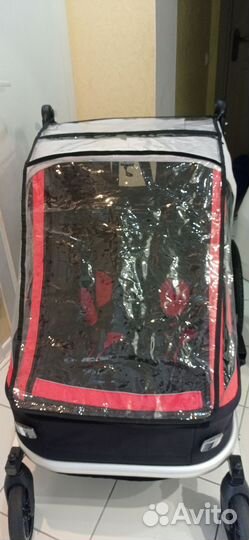 Велосипедный прицеп для двоих детей