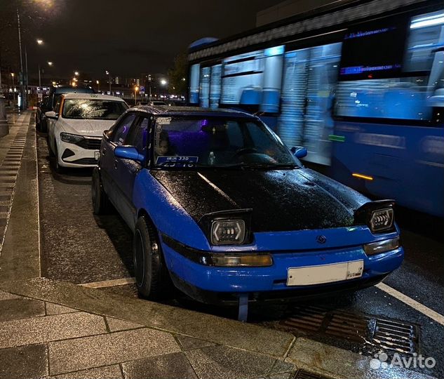 В разборе слепая Mazda 323f BG