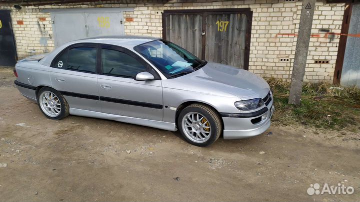 Накладки бамперов, спойлера, пороги опель омега б