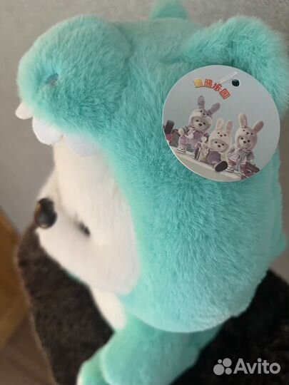 Плюшевый мишка в капюшоне дракона