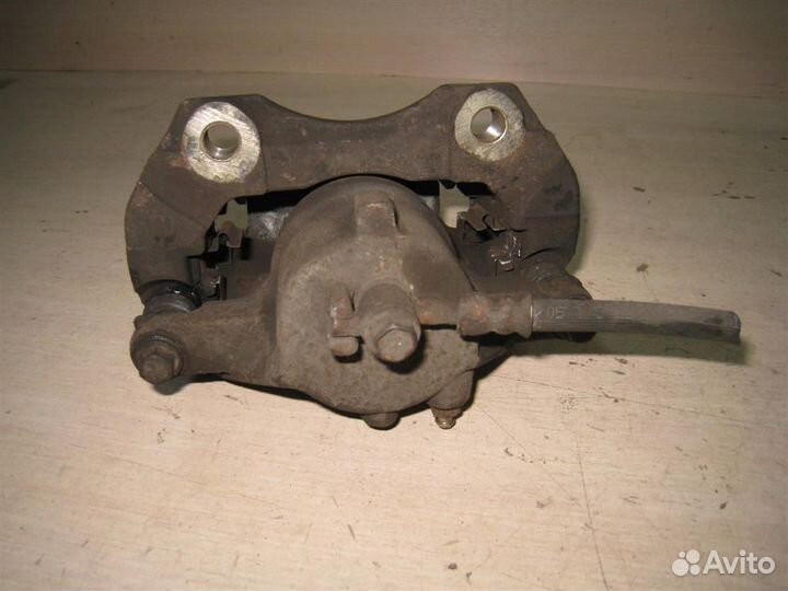 Суппорт тормозной передний левый Nissan Almera Ti