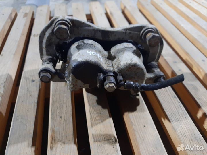 Суппорт тормозной передний левый SsangYong Actyon