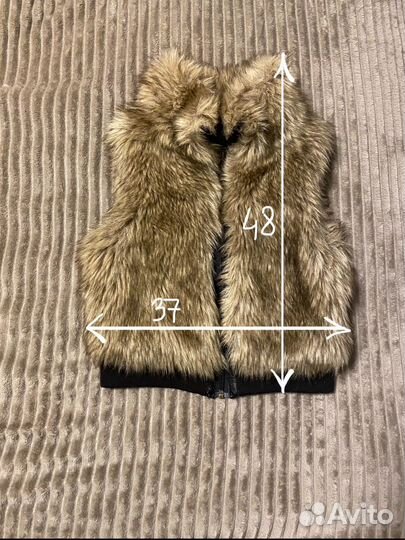 Меховая жилетка