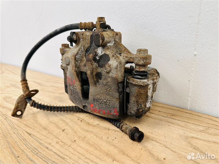 Суппорт тормозной передний левый Kia Cerato 2 1.6