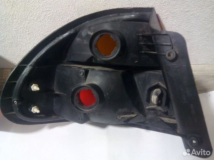 Фонари задние правы и левый Mazda 323 BA (1994—200