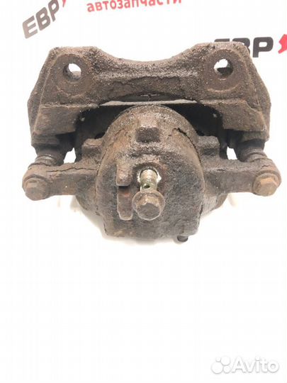 Суппорт тормозной передний левый Nissan Almera N16