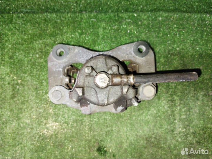 Суппорт тормозной передний левый Mitsubishi Lancer