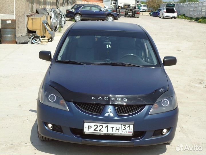 Линзованные фары Lancer 9