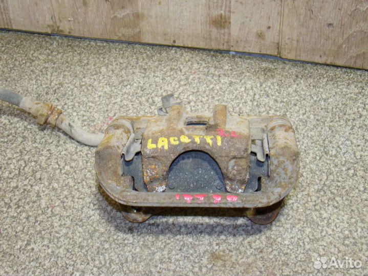 Суппорт задний левый Chevrolet Lacetti
