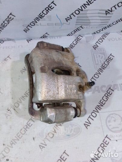 Суппорт тормозной передний левый Kia Sportage 3 SL