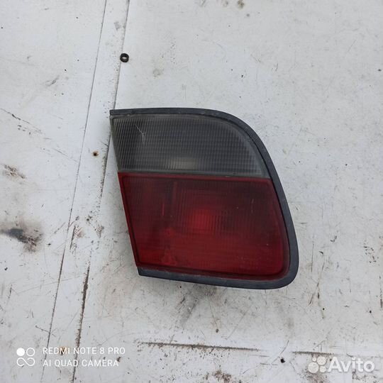 Фонарь левый крышки багажника Nissan Almera n15