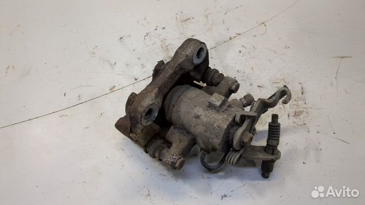 Суппорт левый задний Skoda Yeti