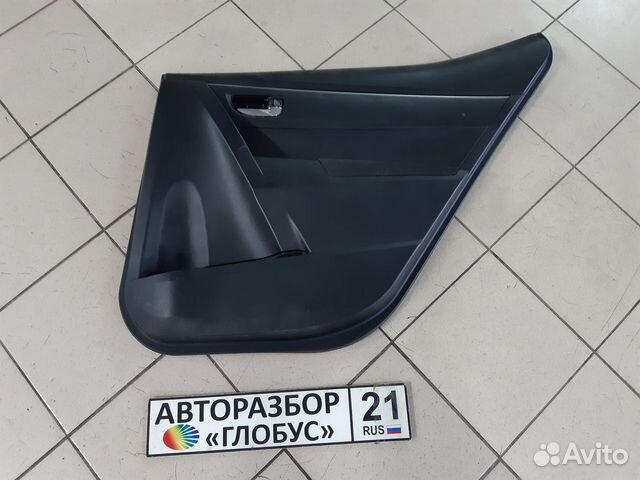 Обшивка двери задняя правая Toyota Corolla 180