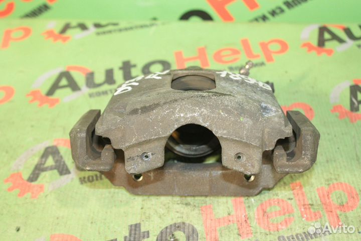 Суппорт тормозной mazda demio DY3W передний левый