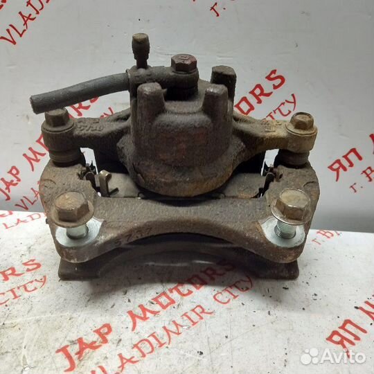 Суппорт тормозной передний левый Mitsubishi Lancer