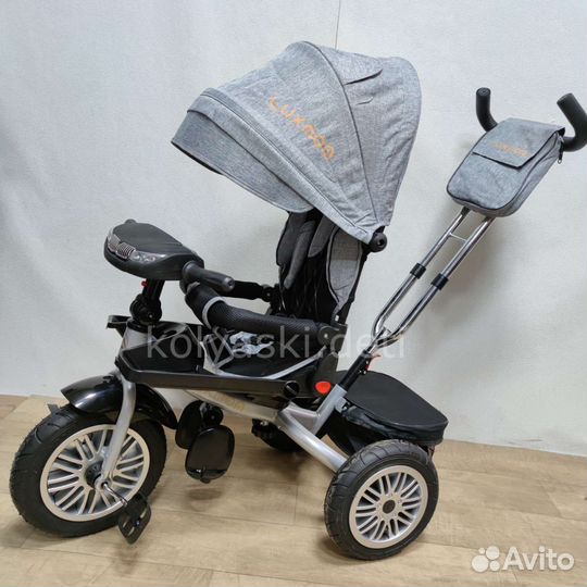 Трехколесный велосипед-коляска BMW