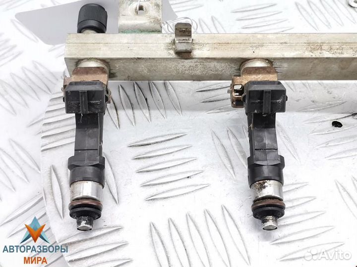 Форсунка Opel Corsa D 2009 55562250