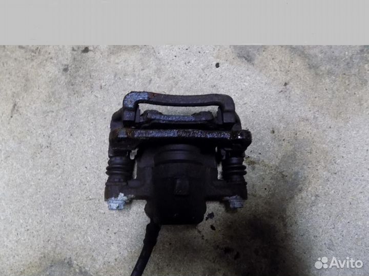 Суппорт задний левый Corolla E12 2001-2006