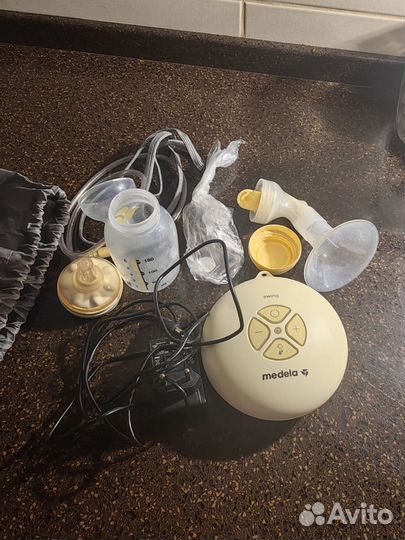 Молокоотсос medela электрический