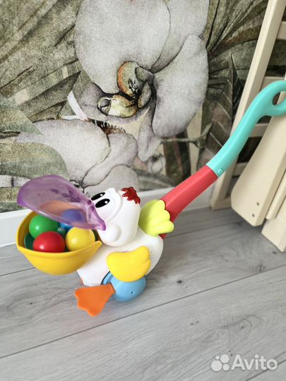 Игрушка каталка с ручкой