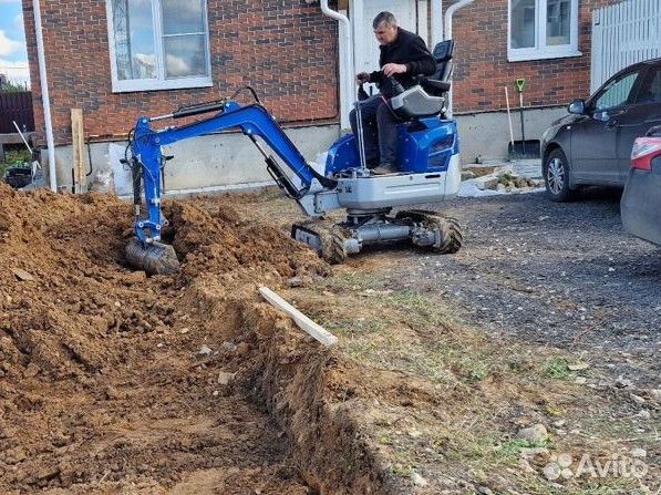 Выравнивание участка мини трактором
