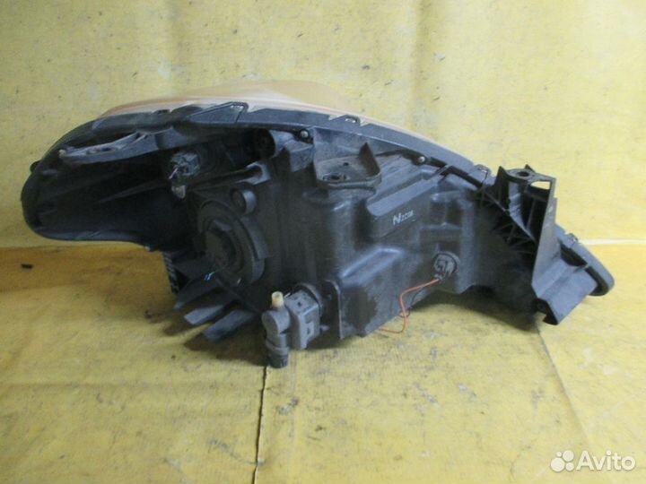 Фара левая Nissan Tiida latio SC11