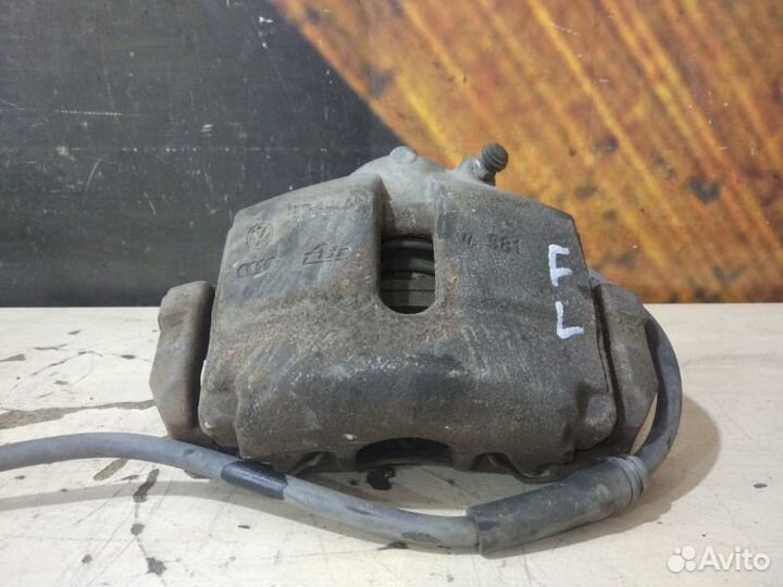 Суппорт передний левый Volkswagen Passat Variant