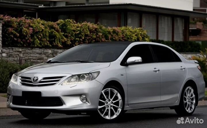 Toyota Corolla e150 Эмбелема решетки радиатора