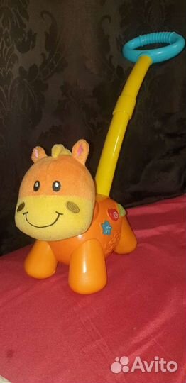 Лошадка каталка музыкальная