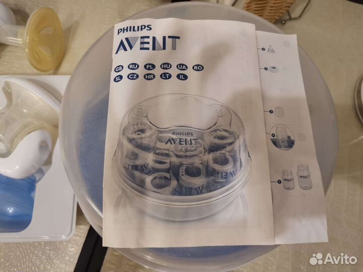 Молокоотсос, стерилизатор и пакеты Avent