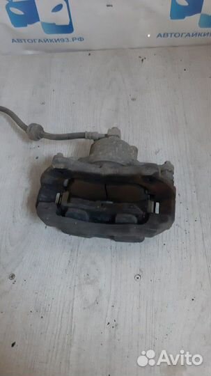 Суппорт передний левый Опель Астра J